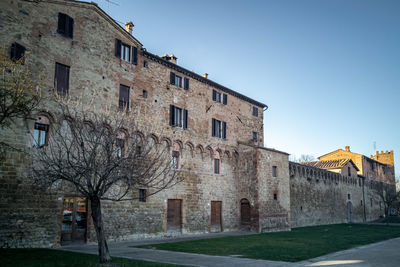 Low angle view of old building against clear sky