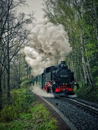 Train on railroad track against sky