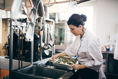 Side view of a woman working