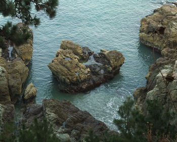 High angle view of rock formation in sea