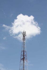 Low angle view of communications tower against sky