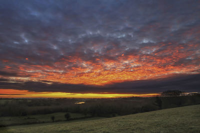 Scenic view of dramatic sky during sunset