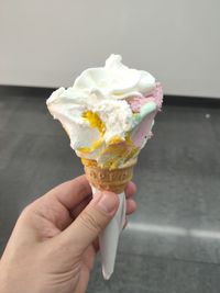 Close-up of hand holding ice cream