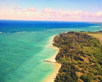Scenic view of sea against cloudy sky