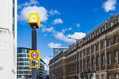 Speed camera mounted on pole enforcing traffic regulations on city street