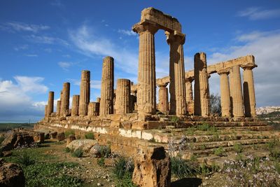 Low angle view of old ruins against sky