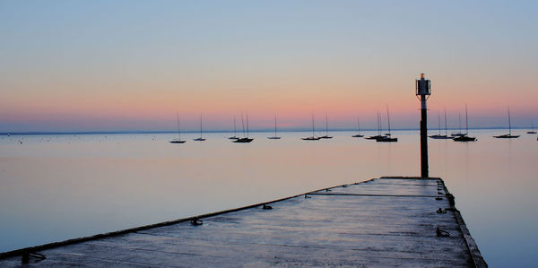 Scenic view of sea at sunset