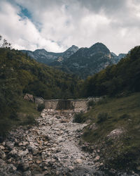 Scenic view of landscape and mountains against sky