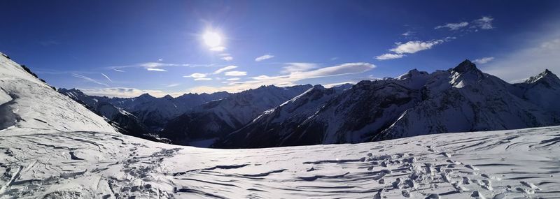 Scenic view of snowcapped mountains against sky