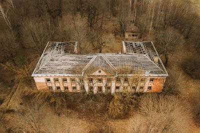 Abandoned house on field