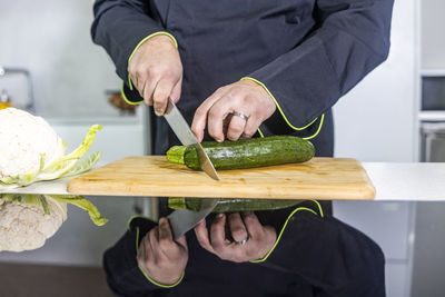 Midsection of man preparing food