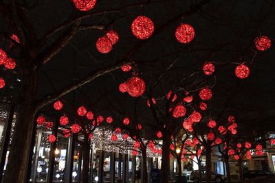 Low angle view of christmas decorations against sky at night