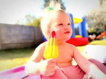 Cute baby girl with toy