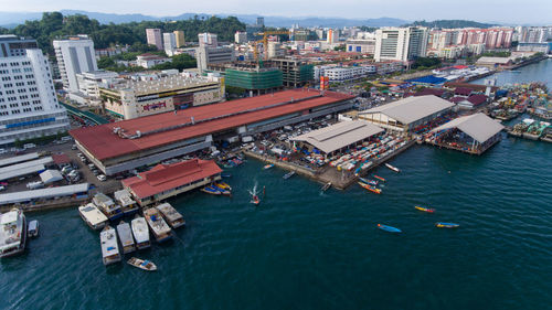 High angle view of cityscape by sea