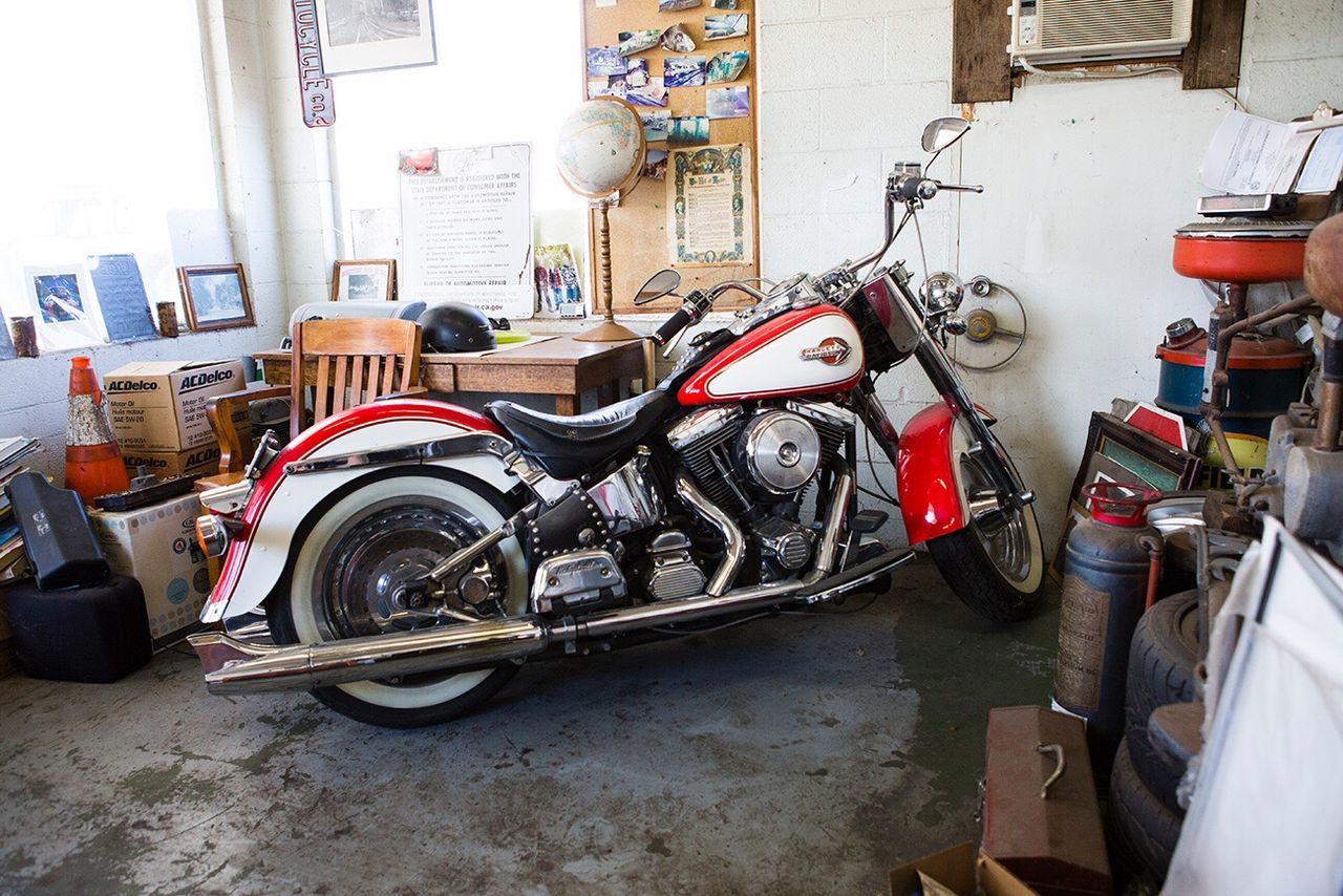 transportation, mode of transport, auto repair shop, land vehicle, workshop, motorcycle, store, no people, day, mechanic, indoors, repair shop, tire