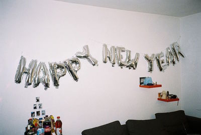 Low angle view of lighting equipment hanging on wall at home