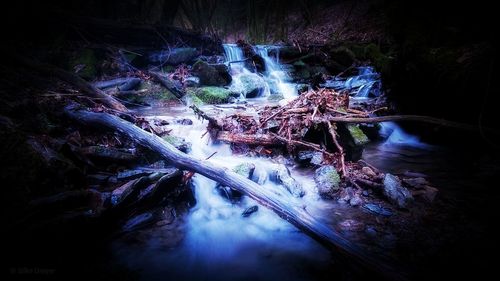 View of waterfall in forest