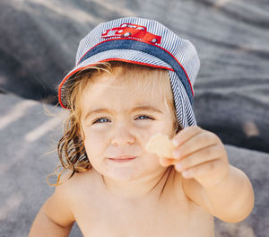 Portrait of cute girl holding food