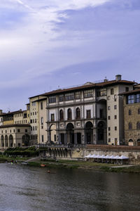 Galleria degli uffizi facade with arno river - florence, tuscany, italy