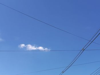 Low angle view of power cables