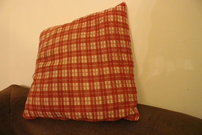 Close-up of sofa against wall at home