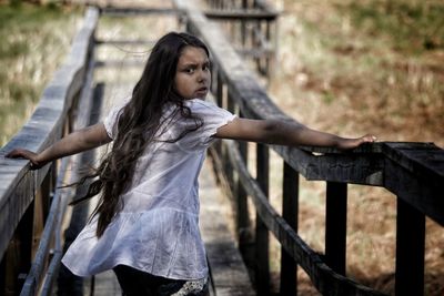 Girl on footbridge