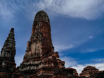 Statue of temple against cloudy sky