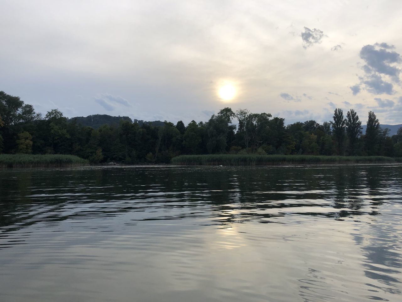 SCENIC VIEW OF LAKE BY TREES AGAINST SKY