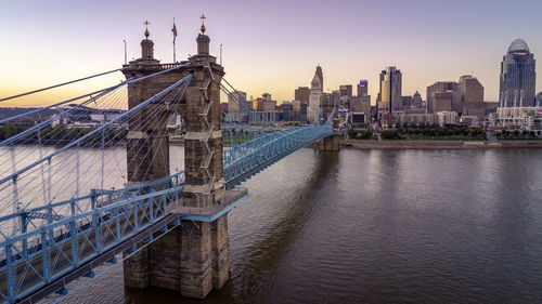 Bridge over river with buildings in background