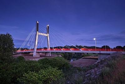 Suspension bridge against blue sky