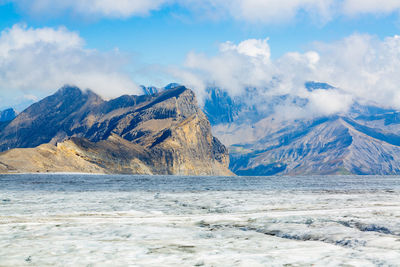 Scenic view of snowcapped mountains against sky