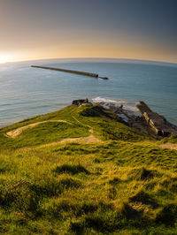 Elevated view of a ancient military pier leading into the water at pointe de la crèche