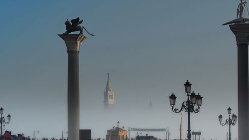 View of street light with city in background