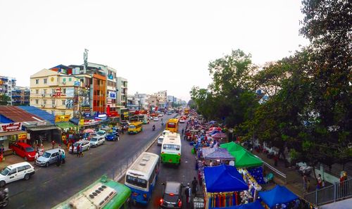 High angle view of street amidst buildings against sky