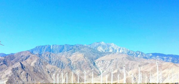 Scenic view of mountains against clear blue sky