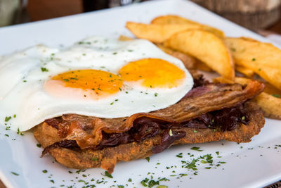 Close-up of bread with meat on plate