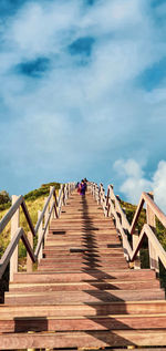 Low angle view of footbridge against sky