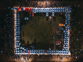 Aerial view of people at market in city during night