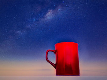 Red wine against blue sky at night