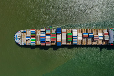 Container ship in export and import business and logistics. shipping cargo to by the sea. 