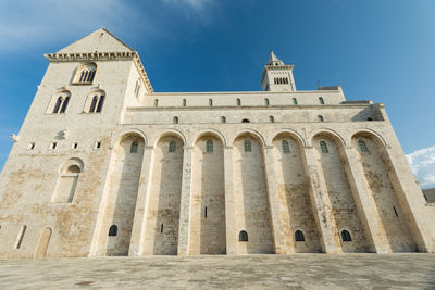 Low angle view of historic building against blue sky