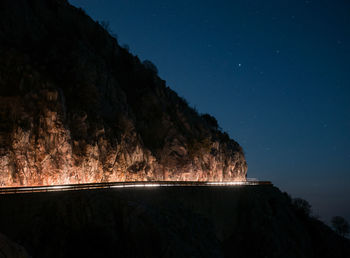 Scenic view of landscape against sky at night