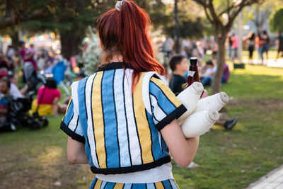 Rear view of teenage juggler