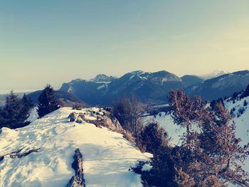 Scenic view of snow covered mountains against sky