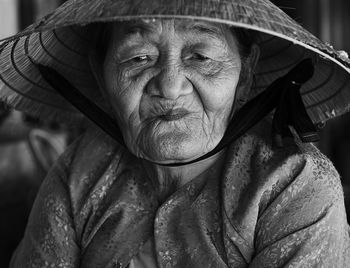 Close-up portrait of senior woman wearing hat