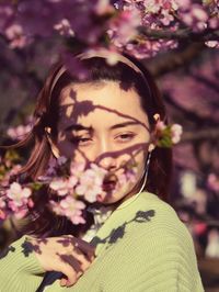 Portrait of woman with pink flowers