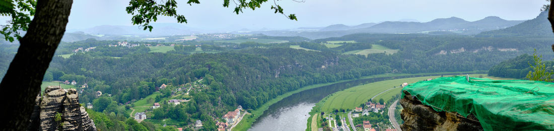 Panoramic view of green mountains against sky