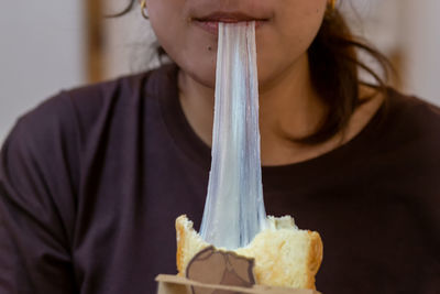 Close-up of woman eating food