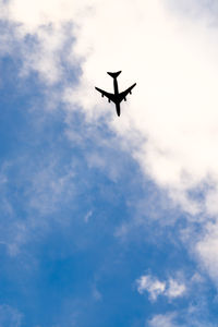 Low angle view of airplane in sky