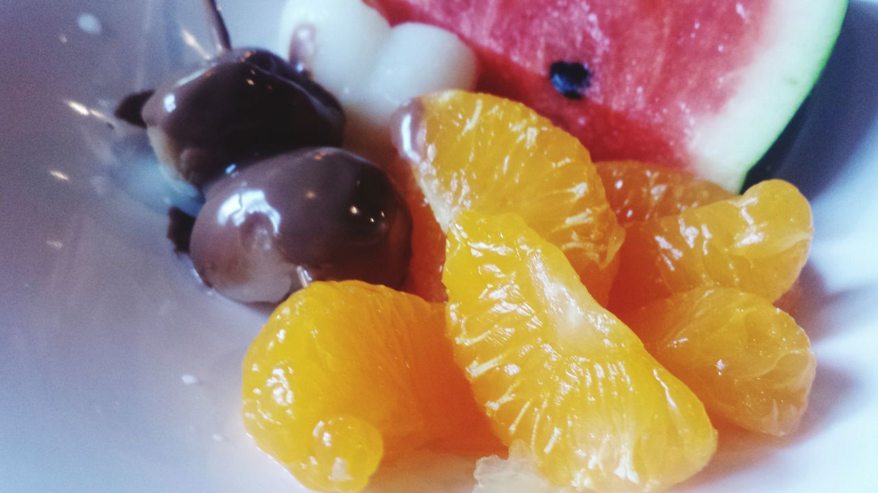 CLOSE-UP OF FRUITS IN GLASS